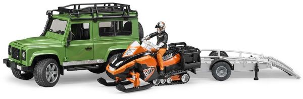 BRU2594 - LAND ROVER Defender avec remorque moto neige et personnage Ech:1/16 - 1