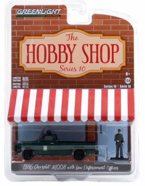 GREEN97100-D - CHEVROLET M1800 1986 vert pick-up police avec policier Série The Hobby Shop vendue sous blister - 1