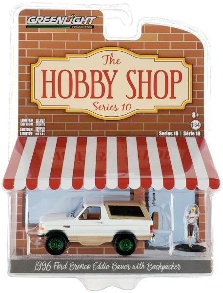 GREEN97100-FVERT - FORD Bronco Eddie Bauer 1996 marron et blanc jantes vertes avec figurine Série The Hobby Shop version Green Metal vendue sous blister - 1
