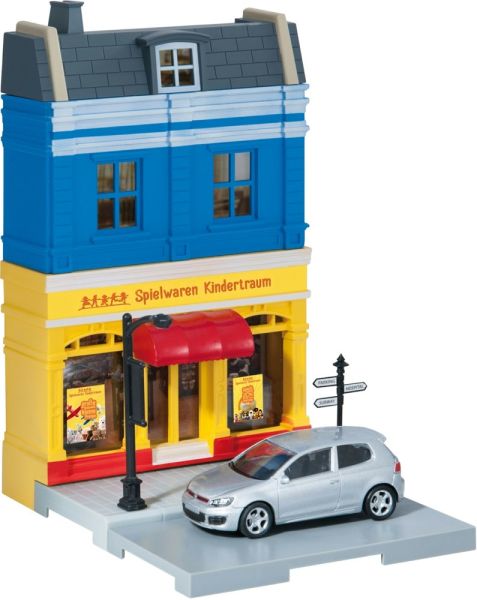 HER800020 - Ensemble avec façade de magasin et VOLKSWAGEN Golf GTI grise - 1