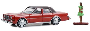 GREEN97150-C - DODGE Diplomat 1983 rouge avec femme en robe  de la série THE HOBBY SHOP sous blister