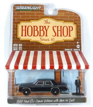 GREEN97100-E - FORD LTD Crown Victoria 1987 noire avec figurine Série The Hobby Shop vendue sous blister
